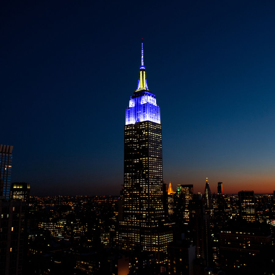 ESB lights in blue and yellow for Chuck Scarborough's 50th On-Air Anniversary
